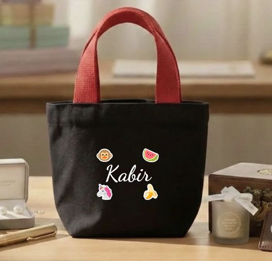 Black mini bag with a child's name and stickers